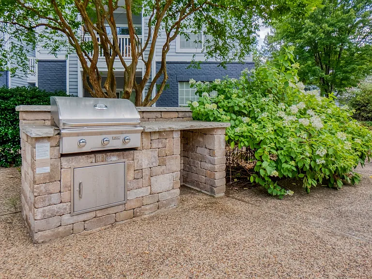 Outdoor grill area conveniently located next to the pool
