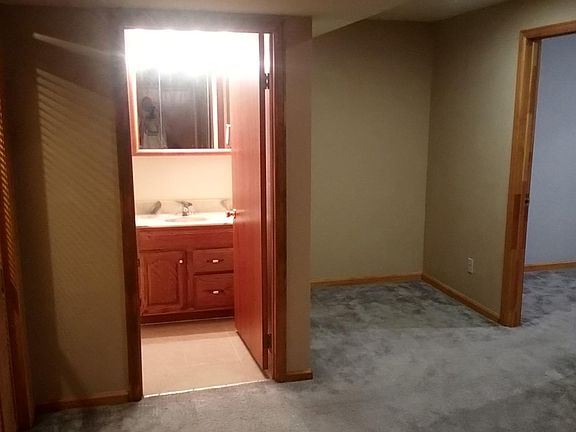 Finished Basement bath which shows second bedroom to the rig