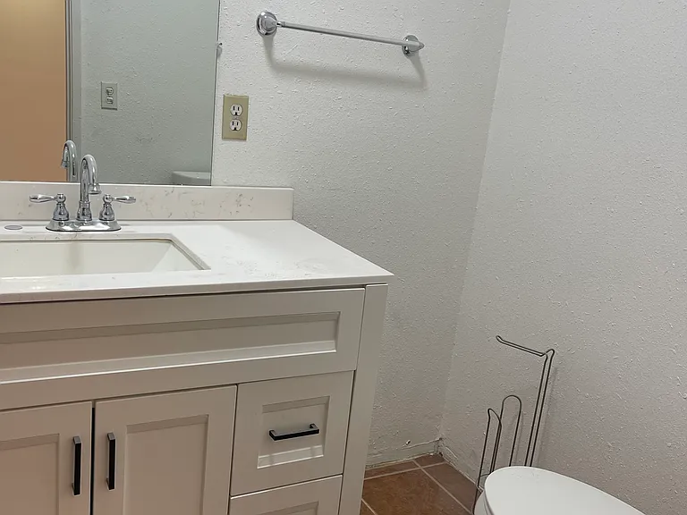 Bedroom 2 features its own remodeled private bathroom.