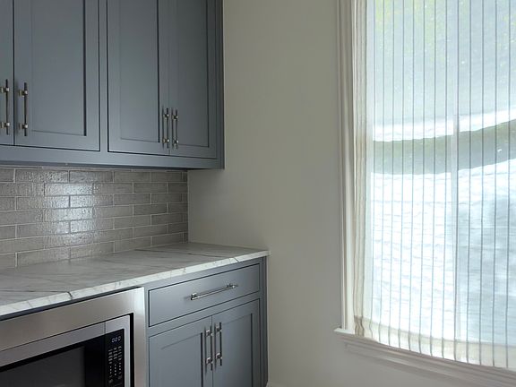 Scullery/Kitchen with built-in microwave, coffee station and extra storage