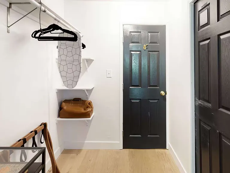 master bedroom closet - ensuite bathroom entry door on right
