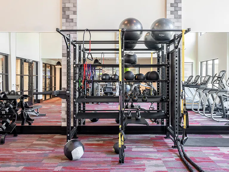 24-hour fitness center with cardio and weight-training