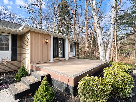 Front entrance with a great size front patio. New landscape with gorgeous existing birch trees- privacy is all yours.