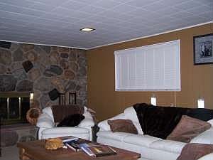extended living room with wood-burning fire place