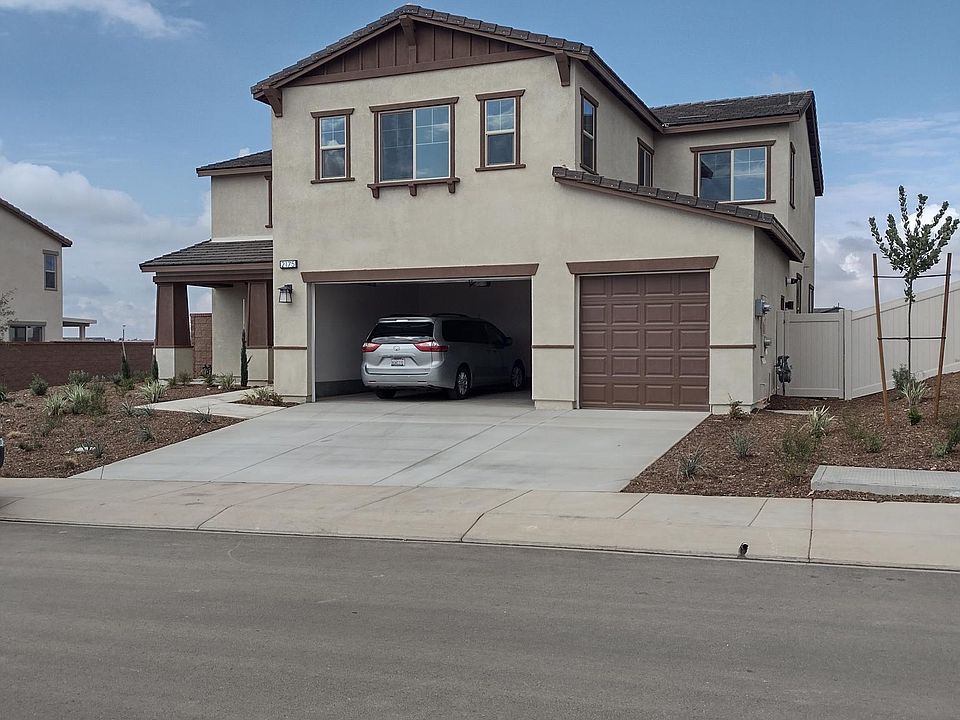 View of house with 3 car garage