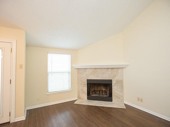 Wood burning fire place with updated surround and mantle.