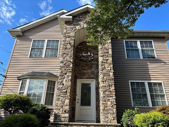 Stone Entrance w/ Chandelier