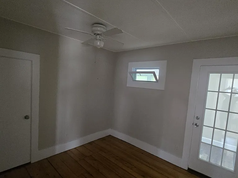 Bedroom with entrance to three season porch.
