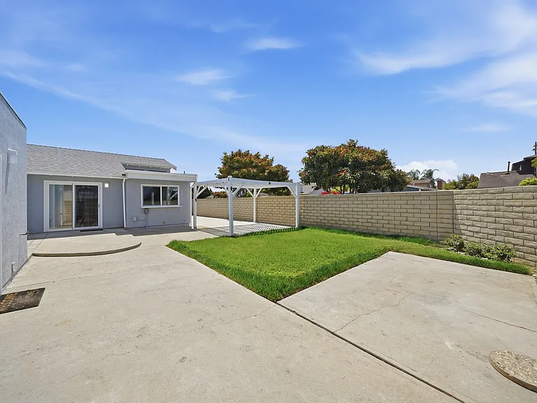 Large Expansive Backyard, low maintenance, detached garage to the right.