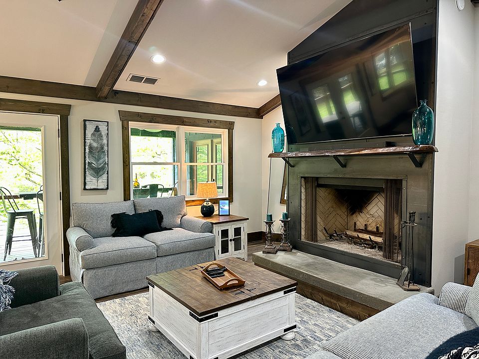 Open Main Living Area with wood-burning Fireplace
