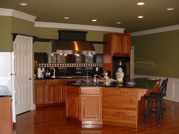 gourmet kitchen, solid counters, cherry cabinets