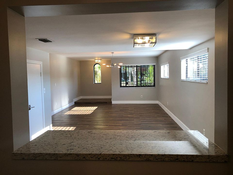 Living/ dining area (view from the kitchen towards front entrance)