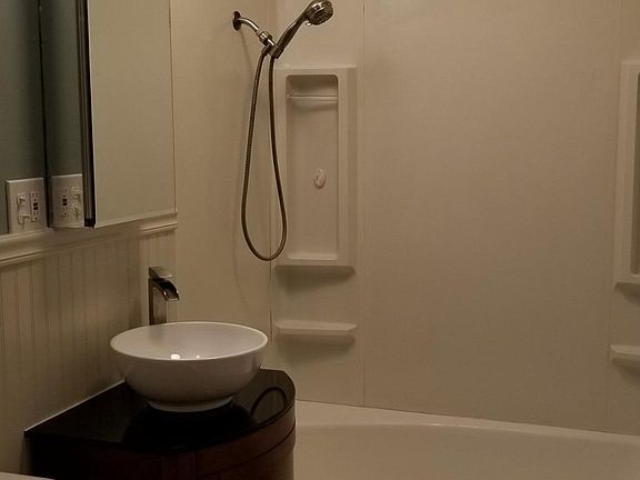 Updated bath with vessel sink on granite top