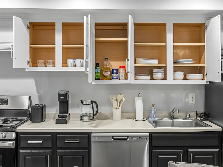 Fully stocked kitchen with cookware and dinning ware