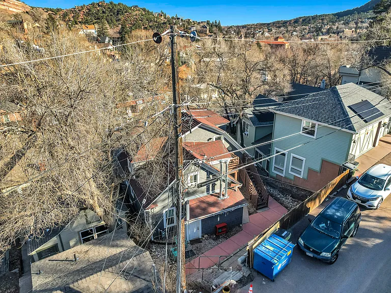 Rear of property (on street parking and property dumpster)