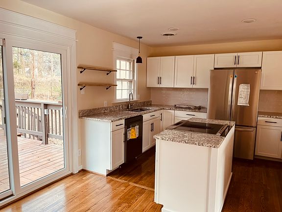 New kitchen connects to large deck perfect for cooking. Deck gets a new coat of paint in the spring!