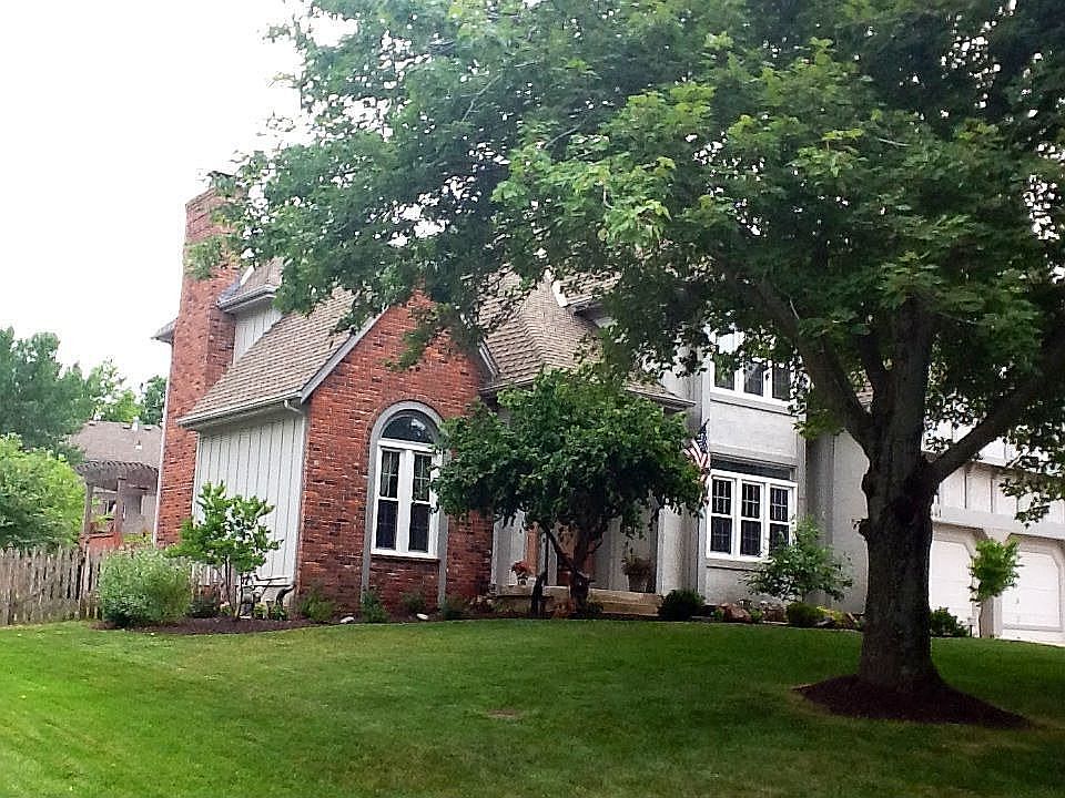 front of the house - large trees and  beautiful established neighborhoodl