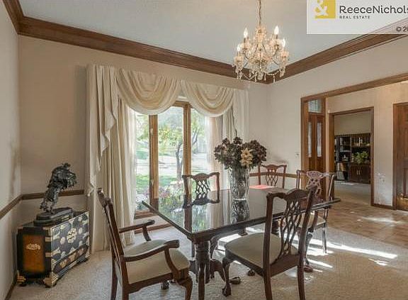 To the right of the entry is an elegant Formal Dining Room with