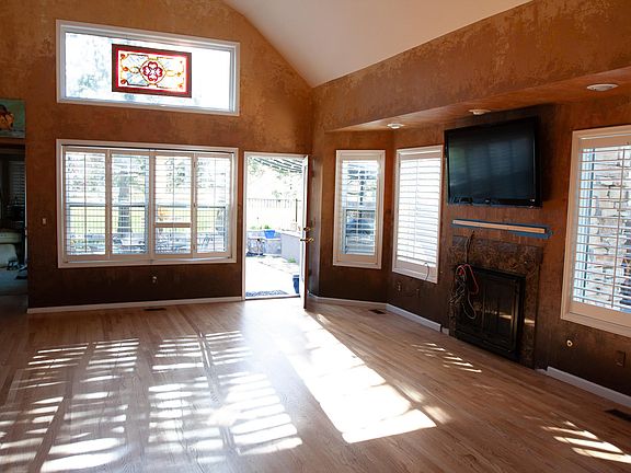 Family room with bay windows and plantation shutters