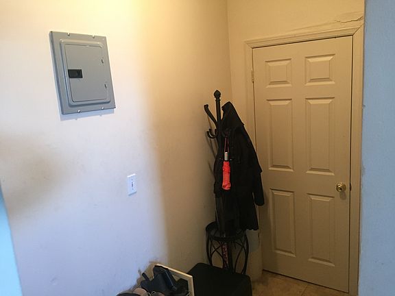Foyer, coat hanger, and closet, while standing in kitchen