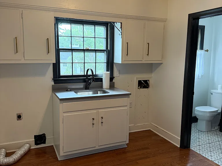 Pantry and laundry room with guest bath