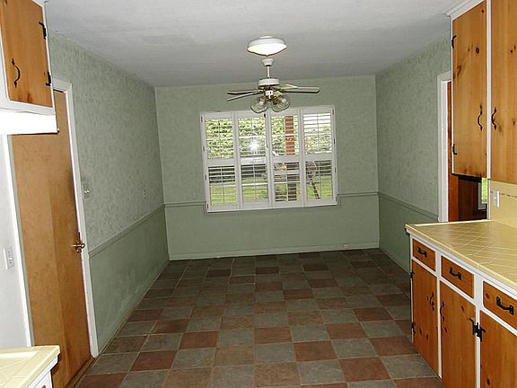 View from formal dining into kitchen and breakfast beyond