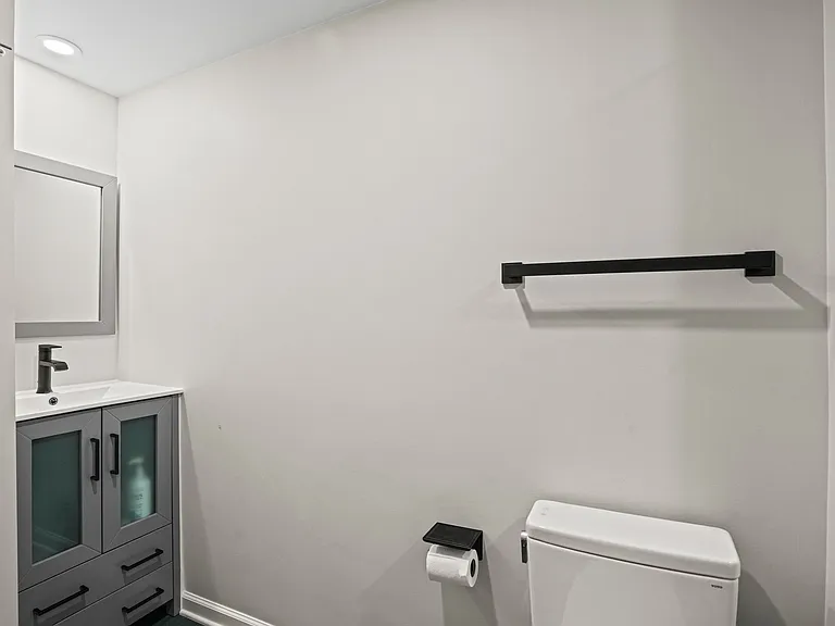 Updated, modern full bathroom featuring neutral tones, premium fixtures, and ample lighting