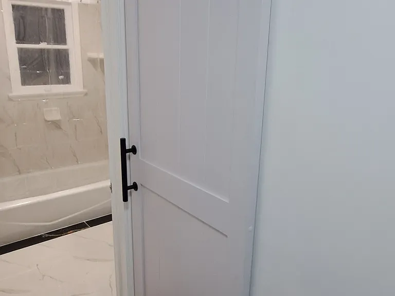 Barn door to cover up washer and dryer in hallway.