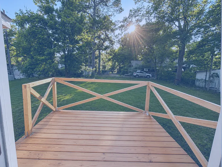 Newly installed back deck include exterior exit and connects to kitchen back door.

Photo Note: Photos have been lightly enhanced to improve lighting and image quality. Colors, finishes, and exterior conditions may vary slightly during in-person viewing.