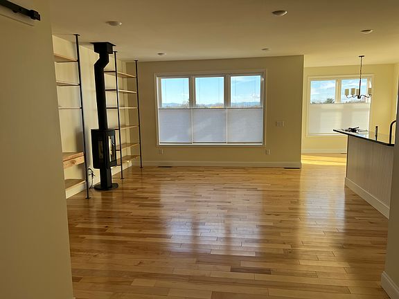 Living room and kitchen looking west to the sunset