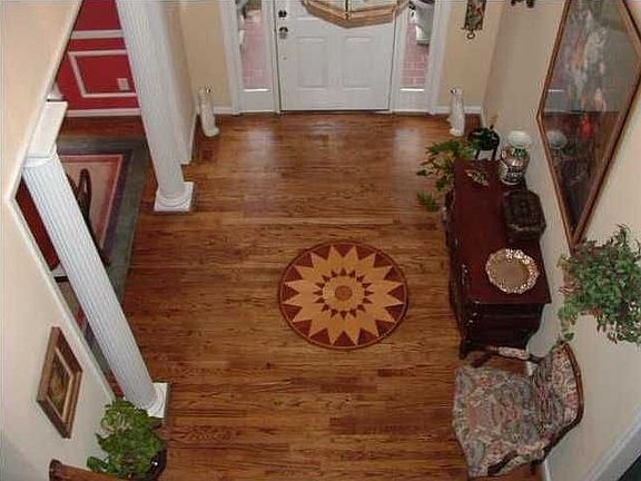 Grand foyer entrance with open staircase.