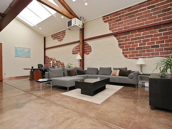 Open Floor Plan With Exposed Beams, Expansive Skylights, Brick Walls, High Ceilings and Doble Pane Industrial Windows 