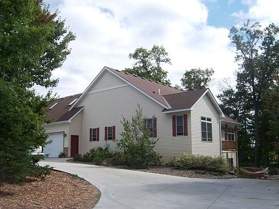 View of the front of home and spacious driveway with a 3-Car Garage.