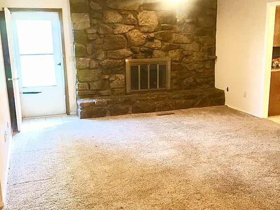 Living Room with Wood Burning Fireplace