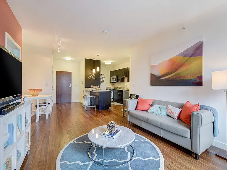 Open concept living rooms feature gleaming bamboo hardwood floors