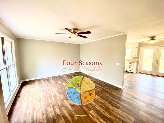 Living room open to dining and kitchen area