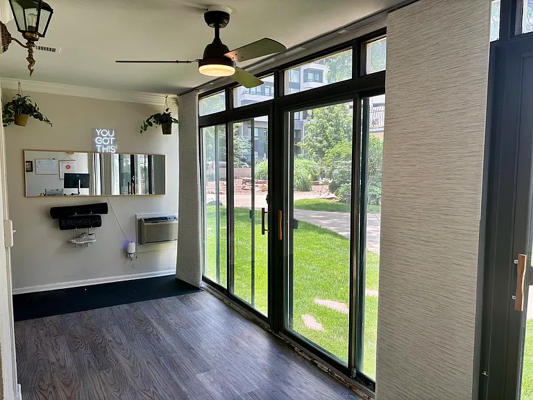 Enclosed patio opening up to courtyard. AC unit has been upgraded since photos were taken.