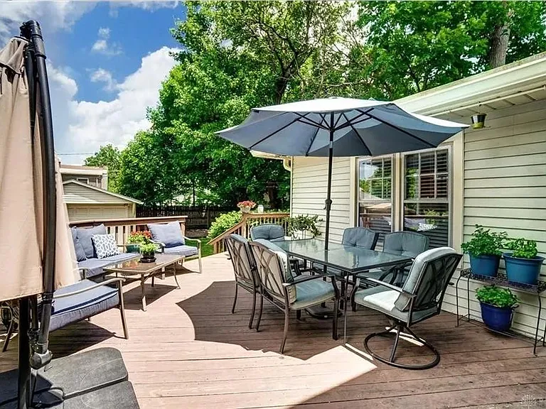 Roomy deck with access from the kitchen and TV room/downstairs master suite.