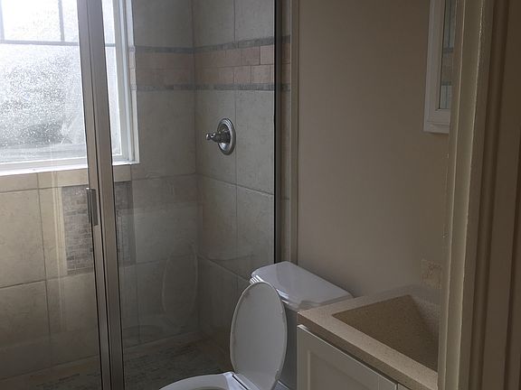 Tile shower with glass door