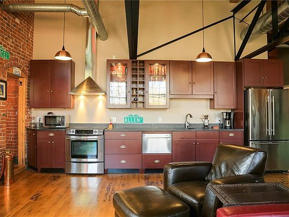 The kitchen area provides clean lines and quality throughout with its solid maple cabinets, superior appliances, granite counters and a cast iron sink.