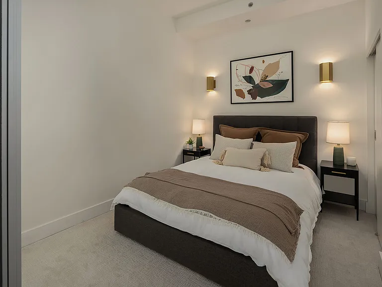 Room & Board queen storage bed & mattress with two storage tables and a California Closet.