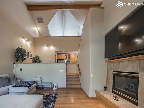 Stay cozy by the fireplace in this Bend Furnished Condo