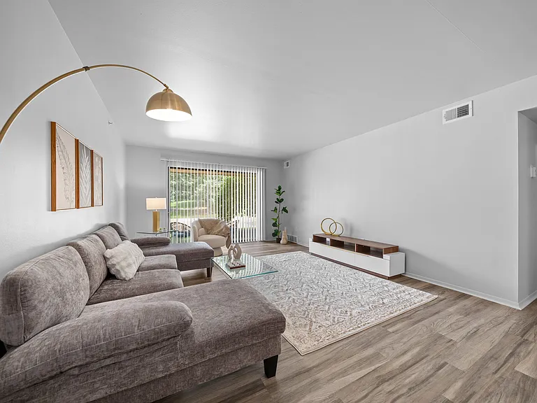 Living room with patio at Dover Hills Apartments in Kalamazoo