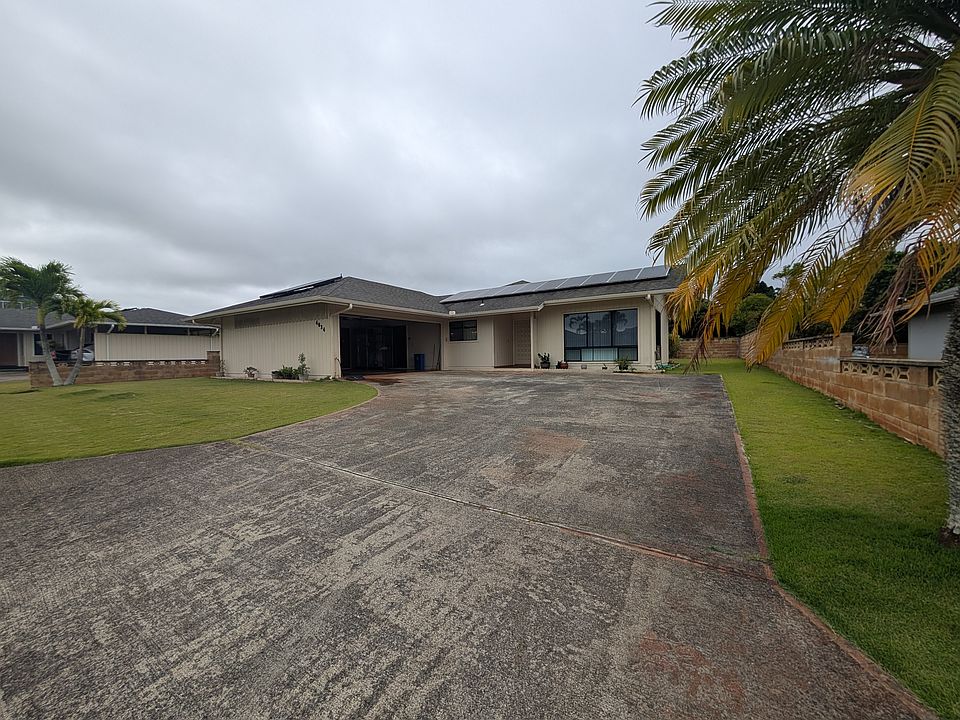 This is the front entrance. There is a big driveway that can fit multiple cars. The garage can fit two cars.