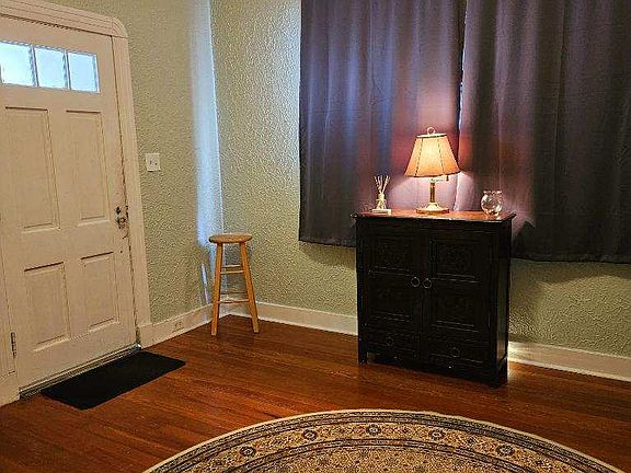 Front Room - Can be used as a home office or dining room. Curtains included.