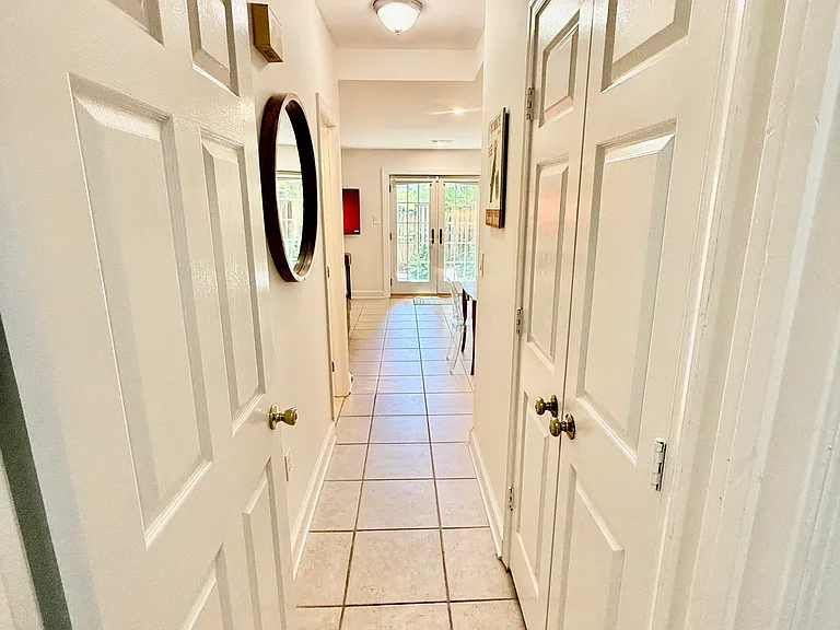 Entrance hall with double door closet.