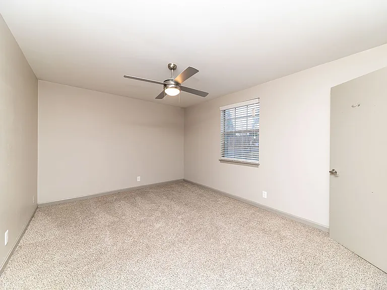 Cozy bedroom with carpet & ceiling fan