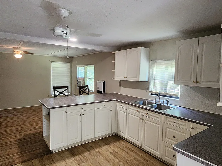 Large kitchen with ample counter space and storage cabinets.