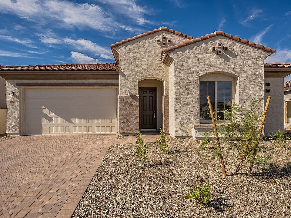 Elegant stucco facade and clay tile roof exemplify luxury design at Mirada Crossing in this stunning