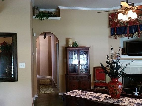 Soaring smooth ceilings, plant ledges and arch door ways.